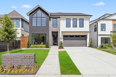 Example of a trendy house exterior design in Dallas