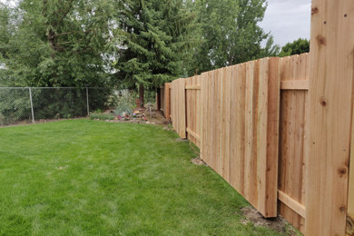 Design ideas for a traditional privacy backyard wood fence landscaping in Boise.