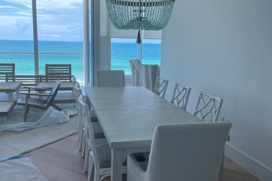 Dining room - coastal dining room idea in Miami
