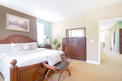 Inspiration for a mid-sized timeless master carpeted and beige floor bedroom remodel in San Francisco with multicolored walls