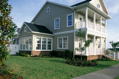 Example of a mid-sized classic home design design in Orlando