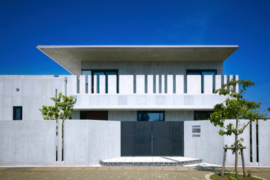 コンテンポラリースタイルのおしゃれな家の外観 (コンクリート繊維板サイディング) の写真