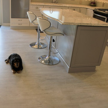 Alpha, IL White and Gray Kitchen with Hidden Laundry and Raised Dishwasher