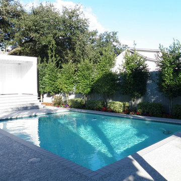 Pool, waterfall, and landscaping