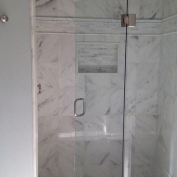 Danby Marble wall tiles and Frameless shower door.