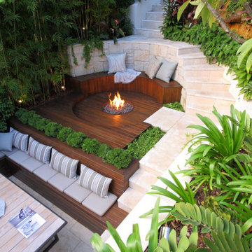 Sloped Backyard Redesign with Structural Terracing and Lawn Areas