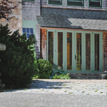 Folding Glass Door Entry with Stone and Shingle Exterior – Manchester-by-the-Sea