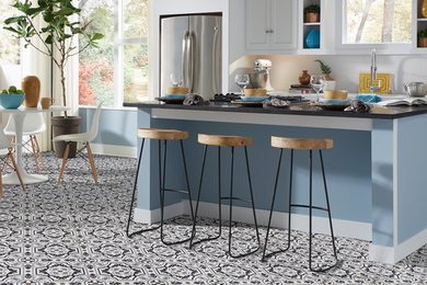 Inspiration for a large eclectic u-shaped vinyl floor kitchen remodel in Philadelphia with an undermount sink, raised-panel cabinets, white cabinets, granite countertops, white backsplash, ceramic backsplash, stainless steel appliances and an island