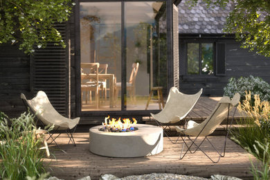 Example of a mid-sized minimalist backyard ground level deck design in Los Angeles with a fireplace and no cover