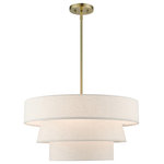 Livex Lighting - Chandler 4-Light Antique Brass Pendant Chandelier - The Chandler pendant chandelier is both modern and versatile. The hand-crafted oatmeal colored fabric hardback shade is set off by the silky white fabric on the inside setting a pleasant mood. The four-light triple drum shade adds character to this handsomely styled pendant.  Perfect fit for the living room, dining room, kitchen and bedroom. This sleek design is shown in an antique brass finish.