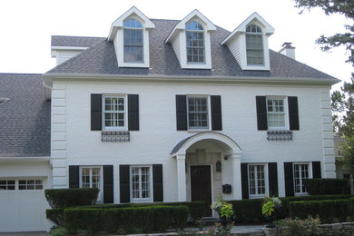 Large elegant white three-story brick gable roof photo in Chicago