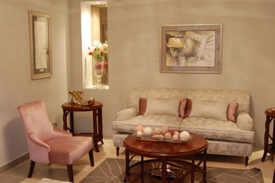 Living room - contemporary enclosed ceramic tile living room idea in Other with beige walls