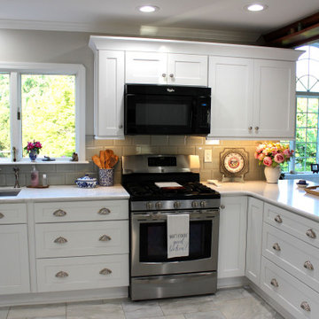 Transitional White Shaker Kitchen With White Marble Look Floor & Countertop