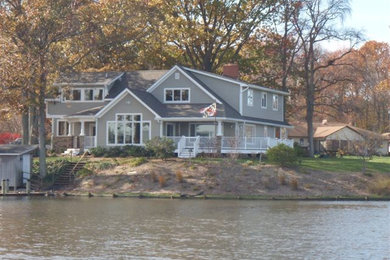 Large traditional gray two-story wood exterior home idea in DC Metro with a shingle roof
