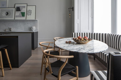 Design ideas for a contemporary dining room in London with grey walls.