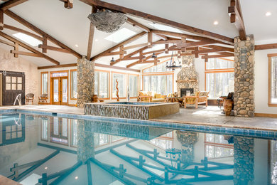 Example of a mid-sized mountain style backyard rectangular lap pool house design