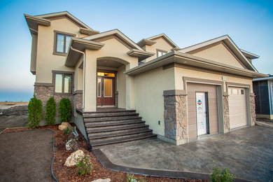 Large elegant beige two-story mixed siding gable roof photo in Other