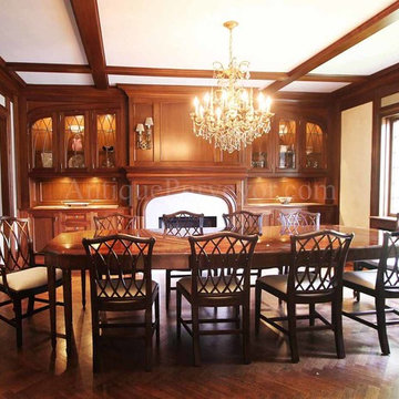 Fine Dining Room with Custom Table and Curved Glass Built-In Display Cases