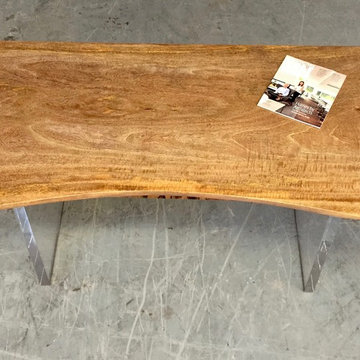 Lucite leg and mango wood slab with raw edge desk.