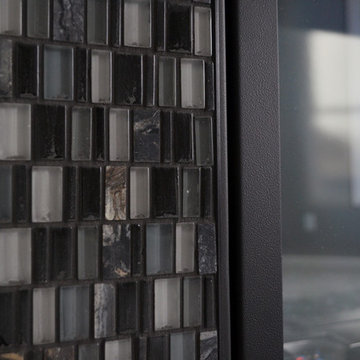 Contemporary Glass and Stone Fireplace Surround