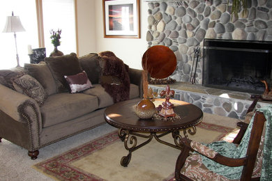 Inspiration for a large timeless open concept carpeted living room remodel in Other with beige walls, a standard fireplace, a stone fireplace and no tv