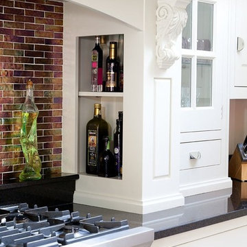Kitchen with large Island in painted plum finish