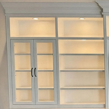 Custom Built-In Media Wall with Glass Display Cabinets