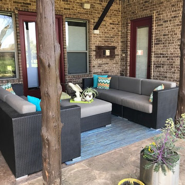 Patio space grounded with neutral Sunbrella Sailcloth Shadow cushions