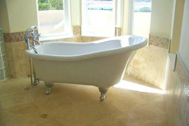 Inspiration for a large transitional master beige tile and ceramic tile ceramic tile and beige floor freestanding bathtub remodel in Austin with beige walls