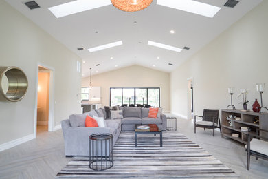 Example of a trendy porcelain tile family room design in Other