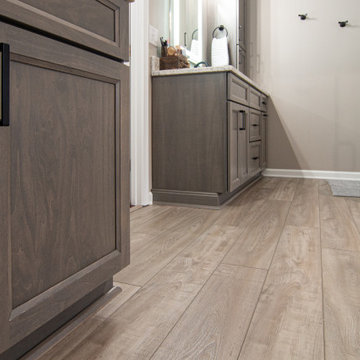 Traditional Master Bathroom With Warm Tones, Stand Alone Tub & Walk In Shower