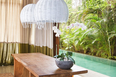 Inspiration for a tropical dining room in Central Coast.