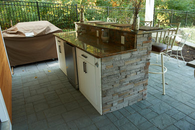 Outdoor Kitchen with Waterfall through Wall
