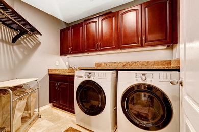 Design ideas for a transitional laundry room in Miami.