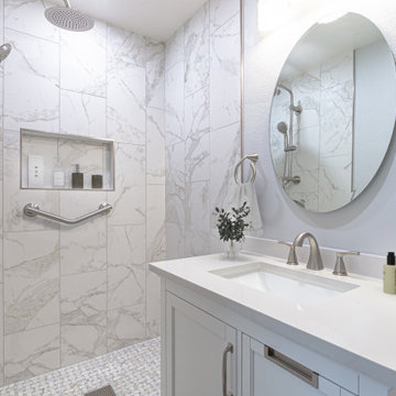 Spacious Walk-In Shower with Marble Tile and Dual Fixtures – Mission Viejo