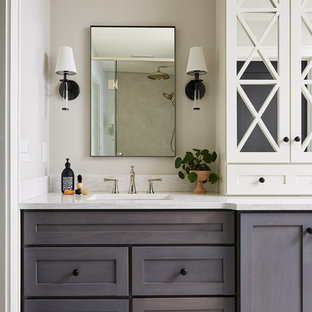 Bathroom - large beach style master porcelain floor and multicolored floor bathroom idea in Minneapolis with shaker cabinets, gray walls, an undermount sink, quartz countertops, white countertops and brown cabinets
