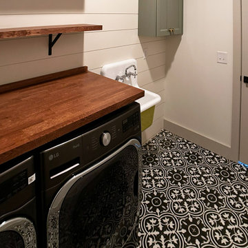 Modern Farmhouse Laundry Room with Shiplap Walls and Black White Patterned Tile