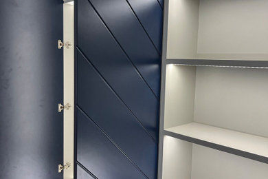 Modern standard wardrobe in Glasgow with blue cabinets.
