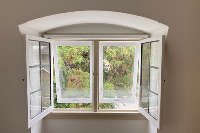Historic casement window rebuild and new traditional storm sash
