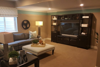 Example of a large transitional walk-out medium tone wood floor basement design in Denver with beige walls
