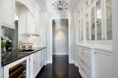Elegant enclosed kitchen photo in Denver