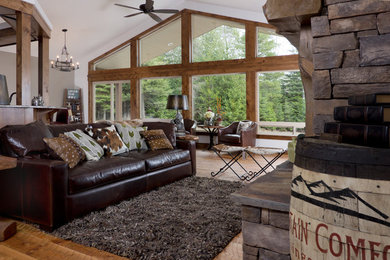 Living room - craftsman open concept medium tone wood floor living room idea in Seattle with white walls