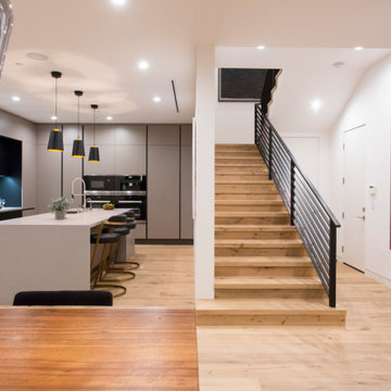 Open Staircase Connecting Kitchen and Living Space