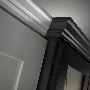Matching white and black cabinetry and moulding