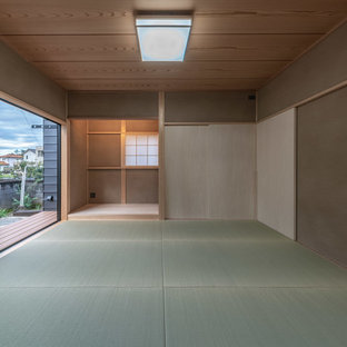 Foto di una camera matrimoniale etnica di medie dimensioni con pareti beige, pavimento in tatami e pavimento blu