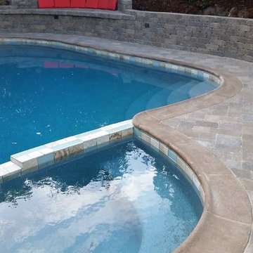Paver Pool Deck and Spa. Retaining wall and Love seat