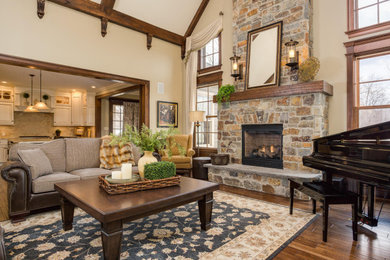 Living room - traditional brown floor and exposed beam living room idea in Other