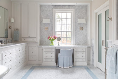 Elegant master marble tile marble floor and double-sink bathroom photo in Other with shaker cabinets, white cabinets, a bidet, beige walls, a drop-in sink, marble countertops, a niche and a built-in vanity