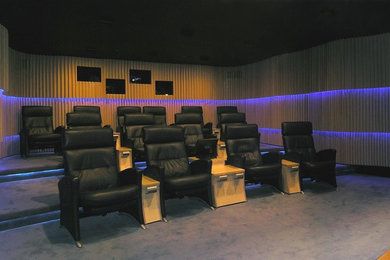 Home theater - contemporary home theater idea in New York