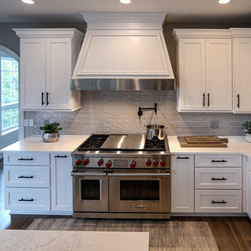 White Transitional Kitchen with Black Hardware and Glass Tile Backsplash